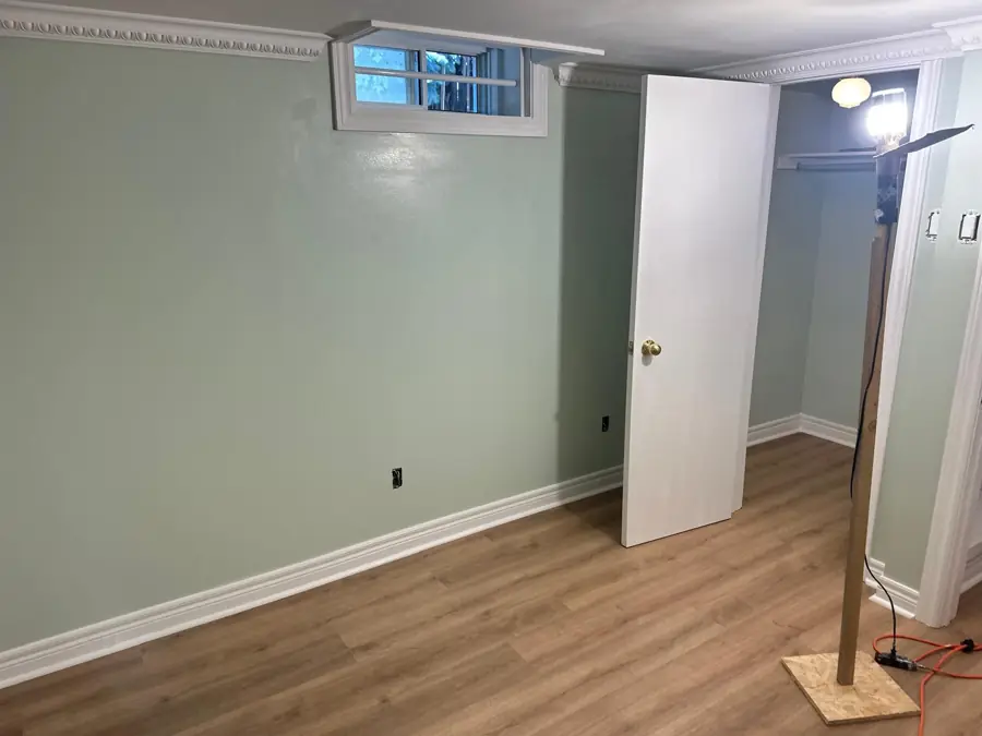 Finished basement room with new flooring