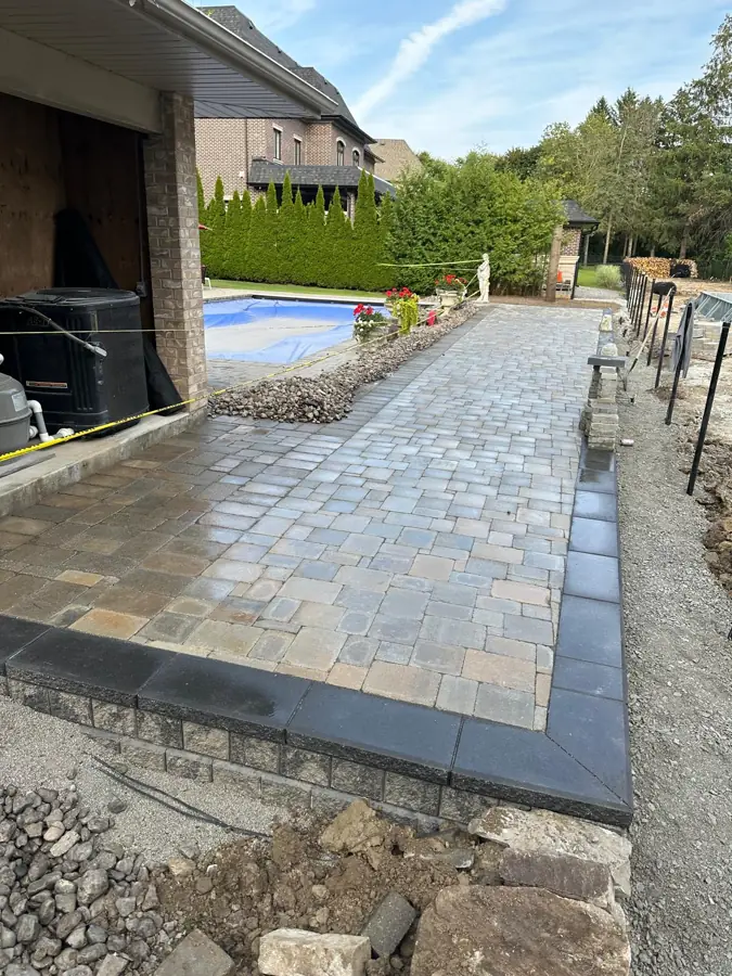 Interlock patio next to a pool